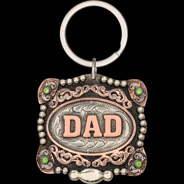 "Woah, is that the Kansas City Buckle? No, it's the Shane Custom Keychain! Crafted after one of our most popular buckles, the Shane Custom Keychain is hand-engraved on a German Silver base with cubic zirconia stones in each Copper corner, featuring C